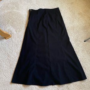Size small 35 inch long a line black side zip polyester skirt.